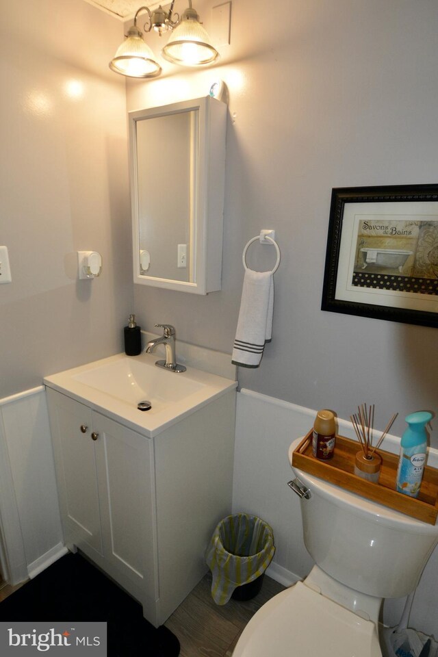 bathroom featuring a paneled ceiling and vanity