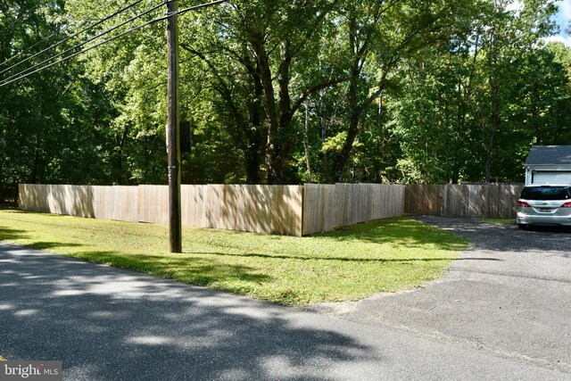 view of side of home with a shed