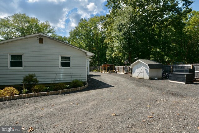 exterior space featuring a shed