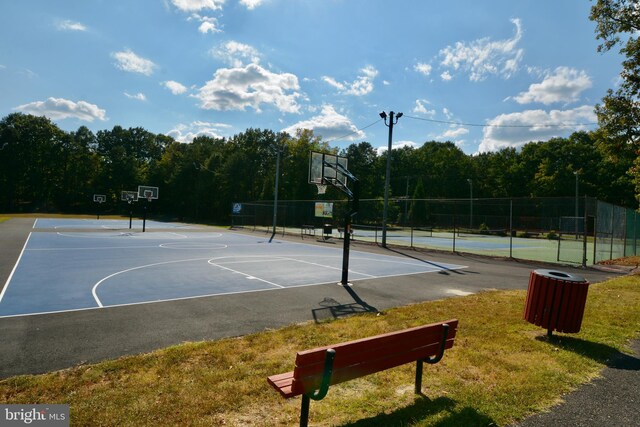 view of basketball court featuring a lawn