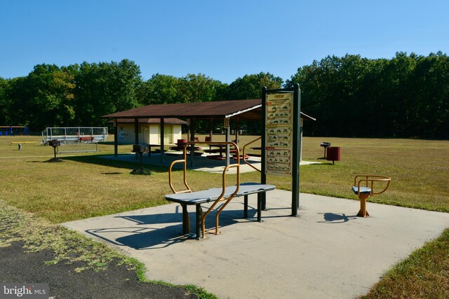 view of community featuring a playground and a yard