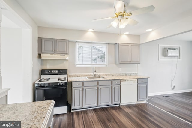 kitchen with ceiling fan, sink, white appliances, gray cabinetry, and dark wood-type flooring