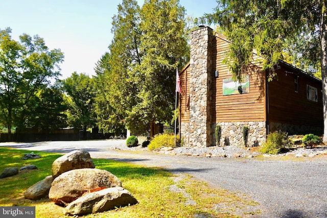 view of home's exterior with a chimney