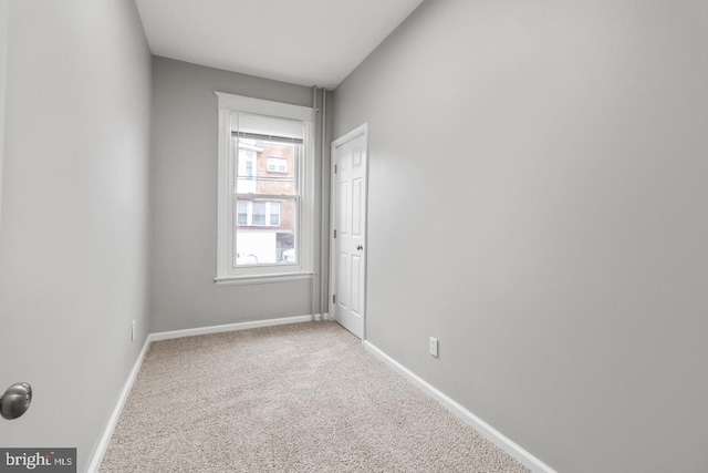 empty room featuring light colored carpet