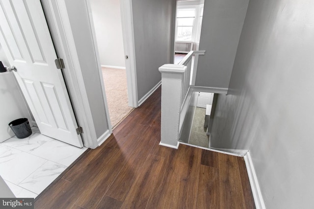 corridor featuring hardwood / wood-style floors