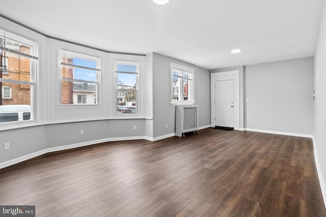 interior space with dark hardwood / wood-style flooring