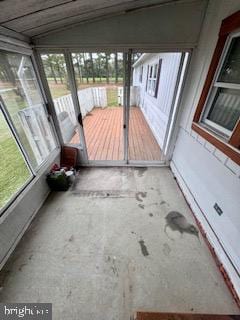 unfurnished sunroom with vaulted ceiling