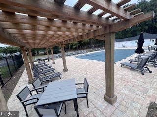 view of swimming pool with a pergola