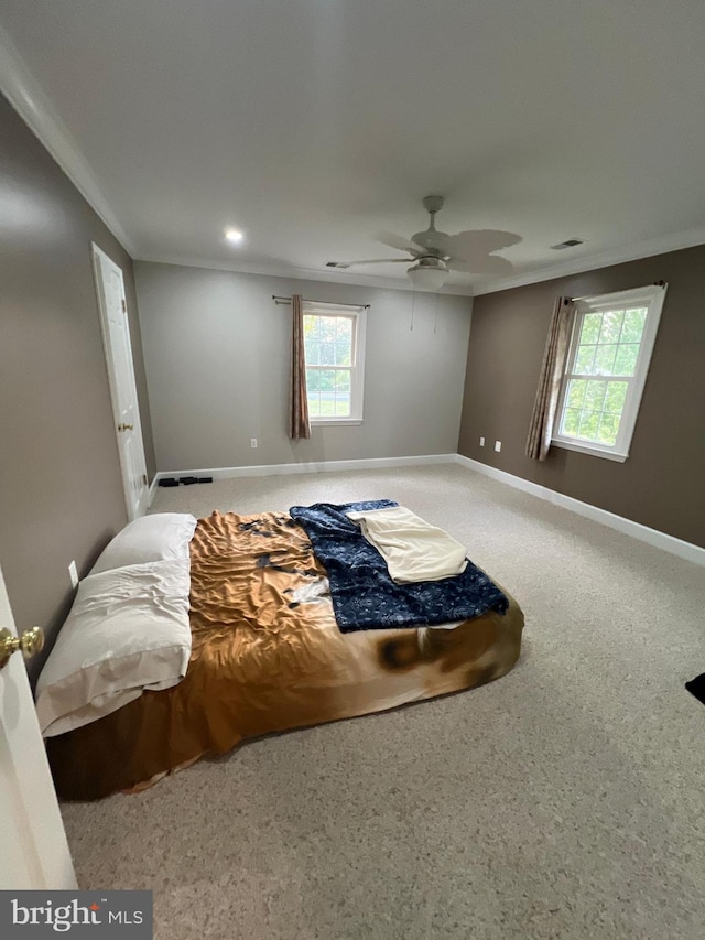 bedroom featuring ceiling fan and ornamental molding