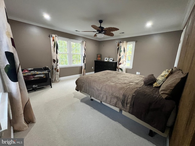 bedroom with light carpet, ornamental molding, and ceiling fan