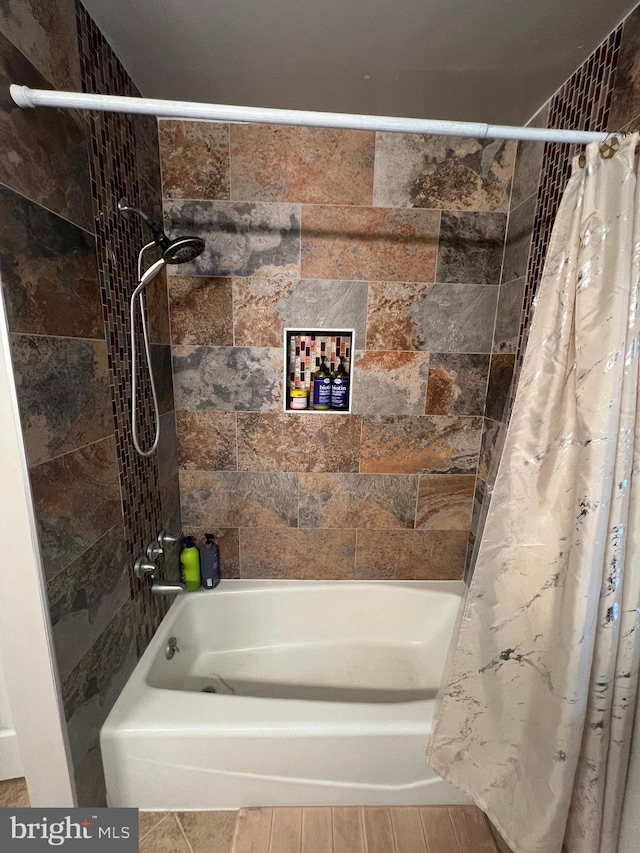 bathroom with shower / bath combo