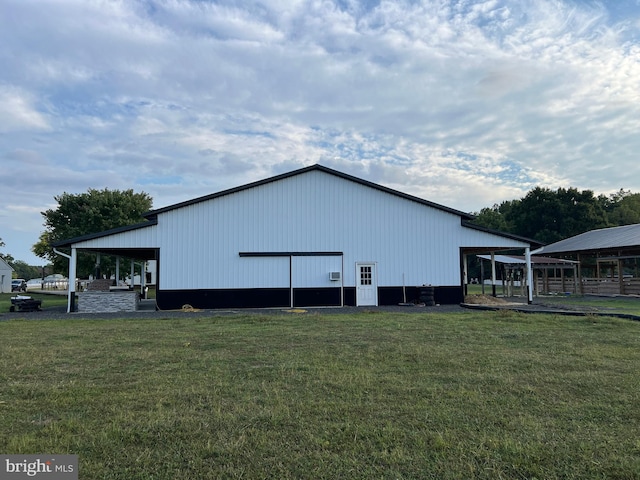 view of outbuilding with a lawn