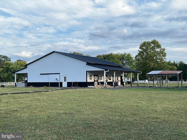 view of outbuilding with a yard