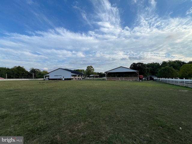 view of yard with a rural view