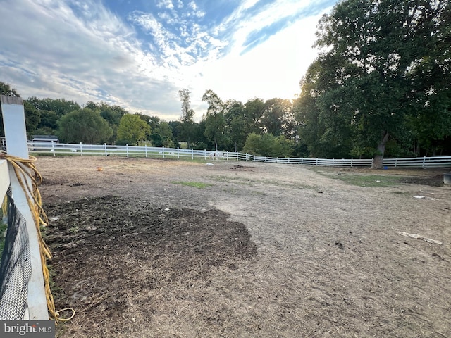 view of yard with a rural view