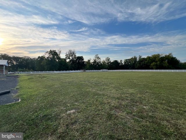 view of yard with a rural view