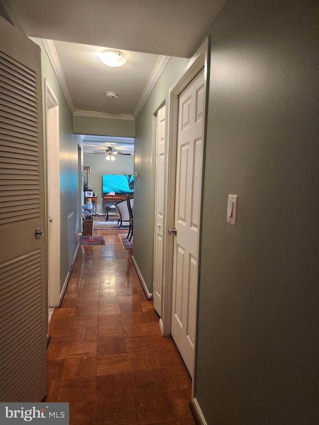 corridor featuring crown molding