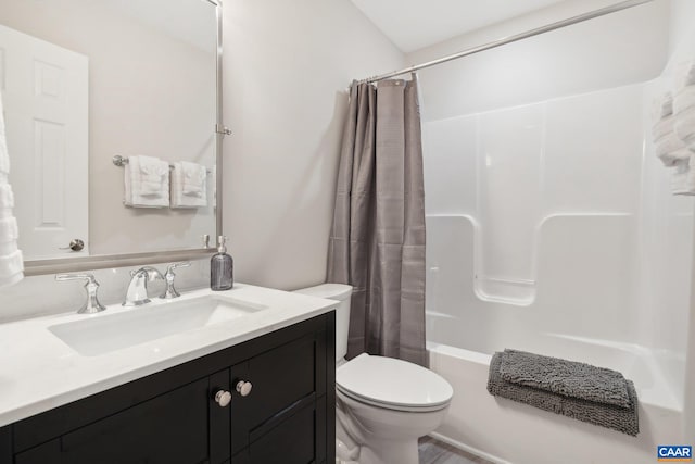 full bathroom featuring toilet, shower / tub combo, and vanity