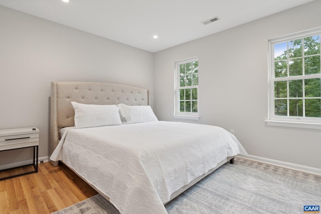 bedroom with wood-type flooring