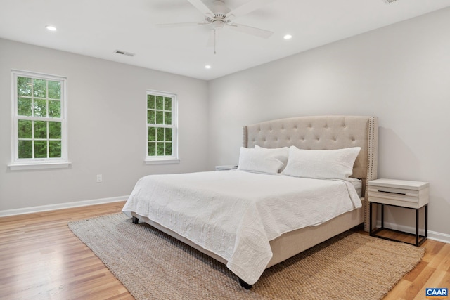 bedroom featuring light hardwood / wood-style flooring and ceiling fan