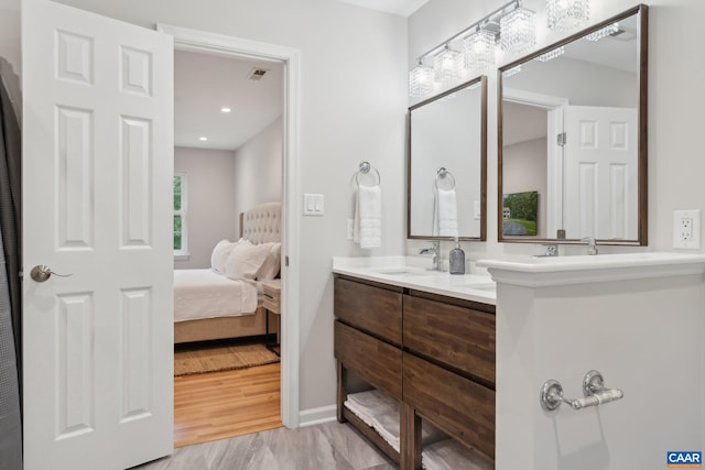 bathroom featuring hardwood / wood-style flooring and vanity