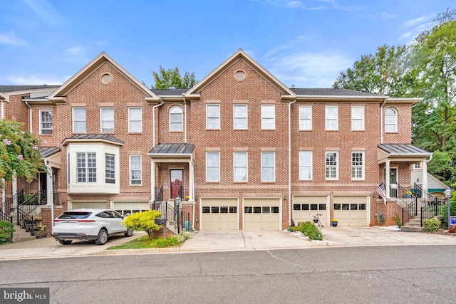 townhome / multi-family property with a garage