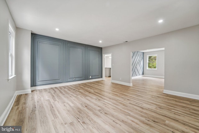 spare room featuring light hardwood / wood-style floors