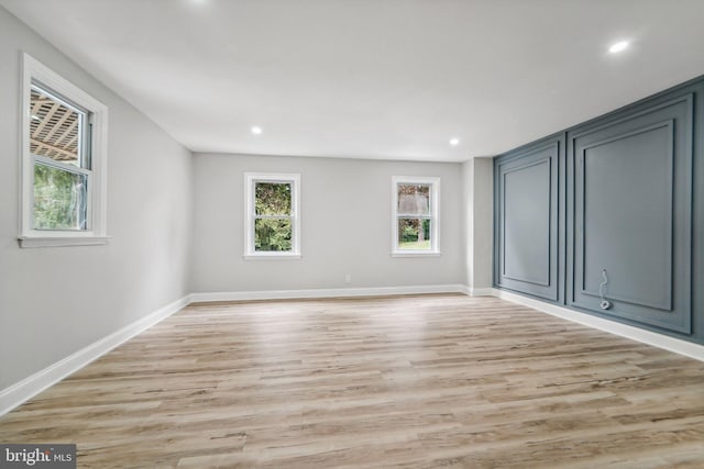 unfurnished room featuring light hardwood / wood-style floors