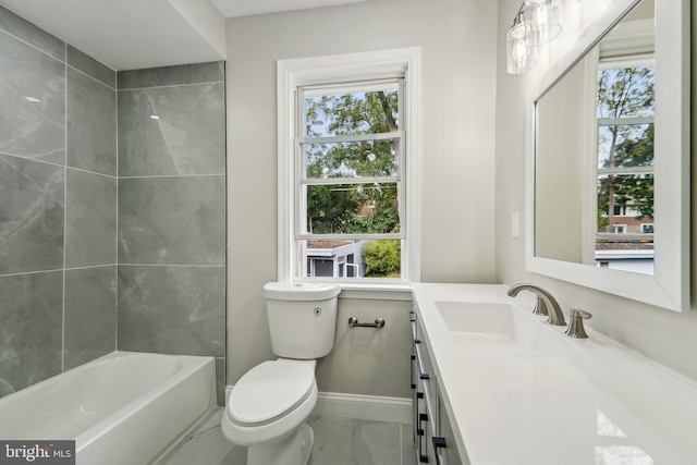 full bathroom with a healthy amount of sunlight, tiled shower / bath combo, vanity, and toilet