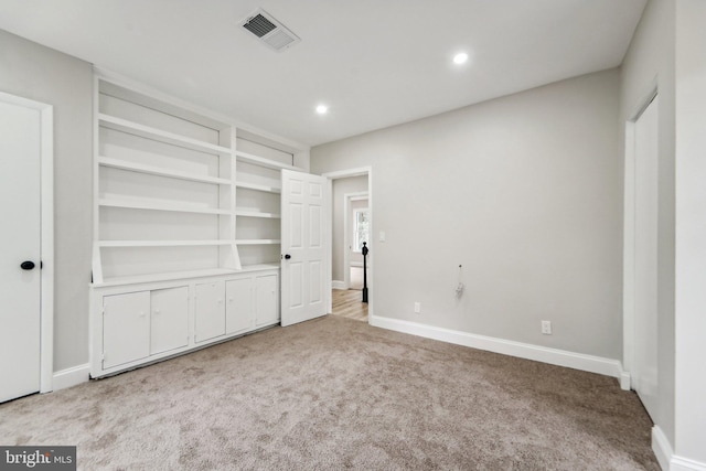 unfurnished bedroom with light carpet