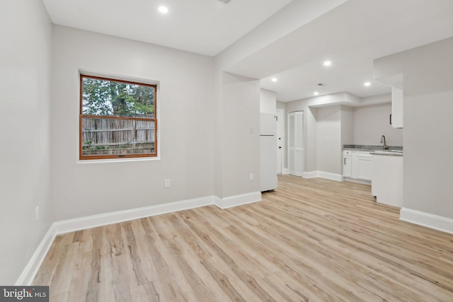 unfurnished living room featuring light hardwood / wood-style flooring