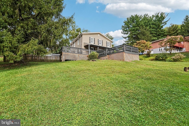 view of yard with a wooden deck