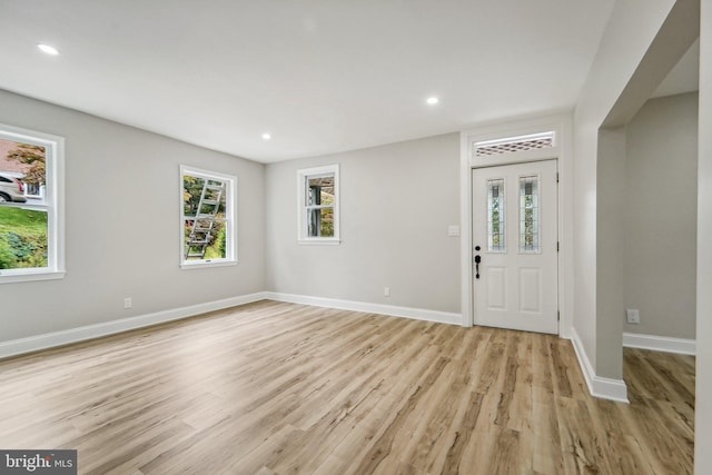 foyer entrance with light wood-type flooring