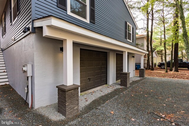 view of side of property with a garage