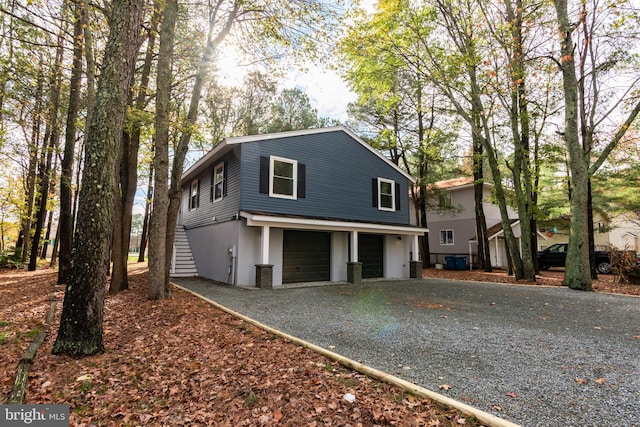 front facade with a garage