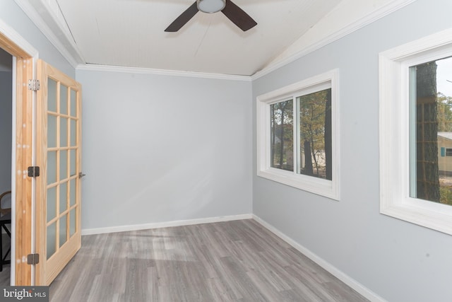 unfurnished room with ceiling fan, a wealth of natural light, and light hardwood / wood-style flooring