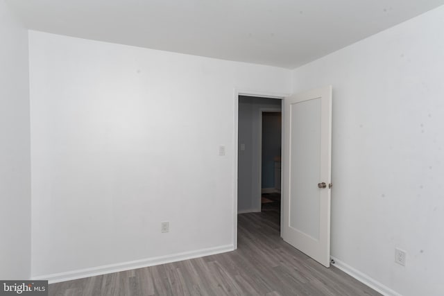 spare room featuring hardwood / wood-style floors