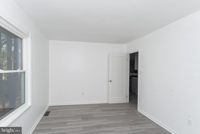 unfurnished room with light hardwood / wood-style floors