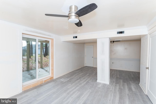 unfurnished room with ceiling fan and light wood-type flooring