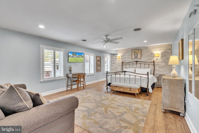 bedroom featuring ceiling fan and light hardwood / wood-style flooring