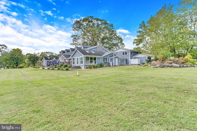 view of front of property with a front lawn