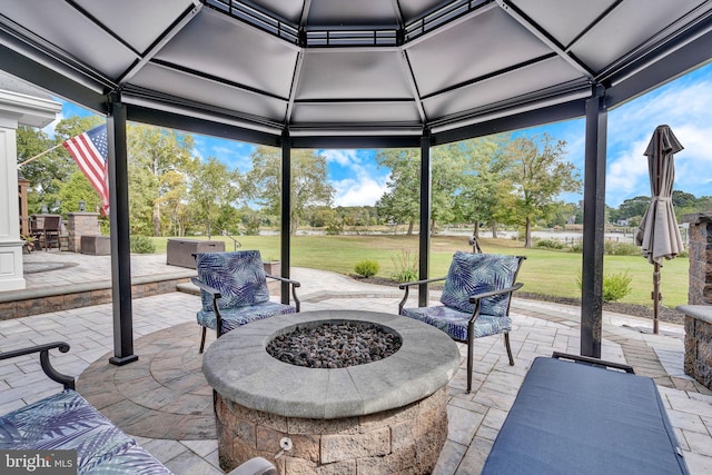 view of patio with a gazebo and an outdoor fire pit