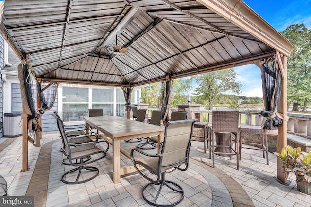 view of patio / terrace with a gazebo and exterior bar