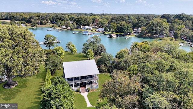 birds eye view of property featuring a water view