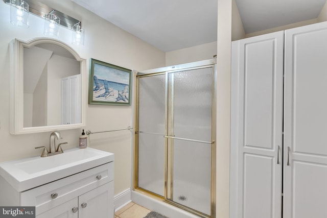 bathroom with vanity, tile patterned flooring, and an enclosed shower