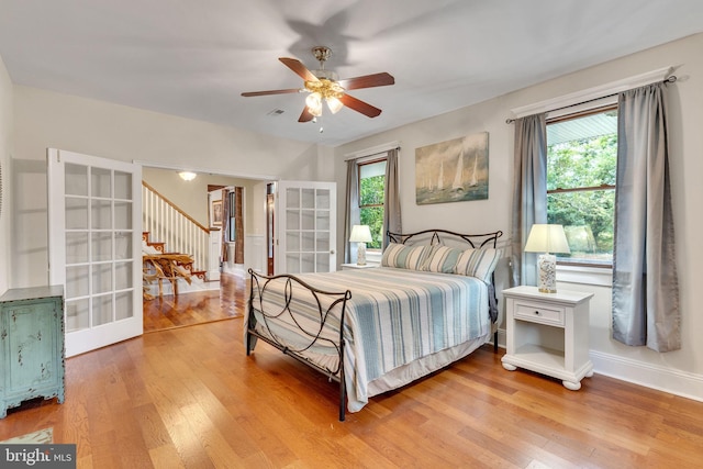 bedroom featuring light hardwood / wood-style flooring and ceiling fan