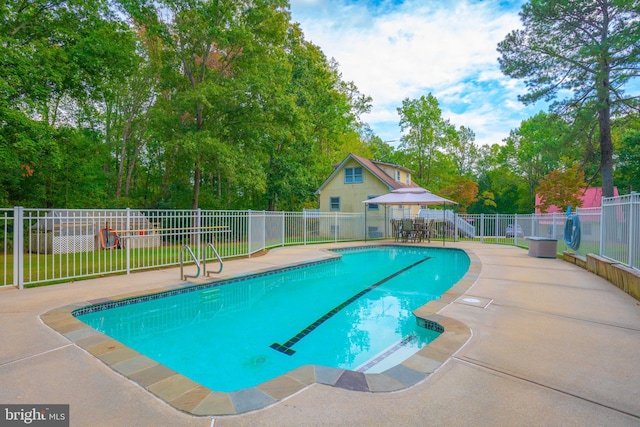 view of swimming pool with a gazebo and a patio area