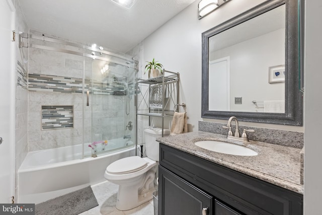 full bathroom with enclosed tub / shower combo, a textured ceiling, vanity, and toilet