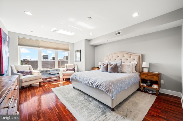 bedroom featuring dark hardwood / wood-style flooring