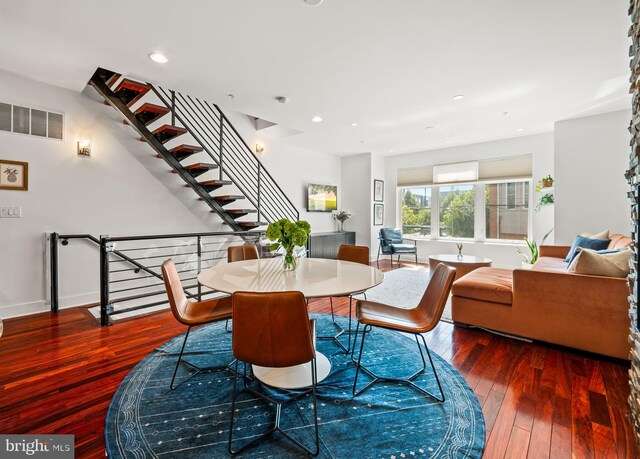 dining room with dark hardwood / wood-style floors